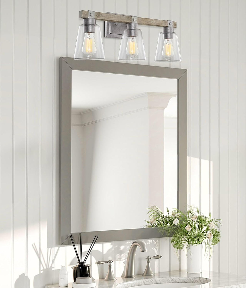 Kira Home Asher 23' 3-Light Farmhouse Vanity Light with Clear Tapered Shades, Hand-Painted Wood Grain Metal Bathroom Light, Bleached Oak Wood and Galvanized Steel Finish